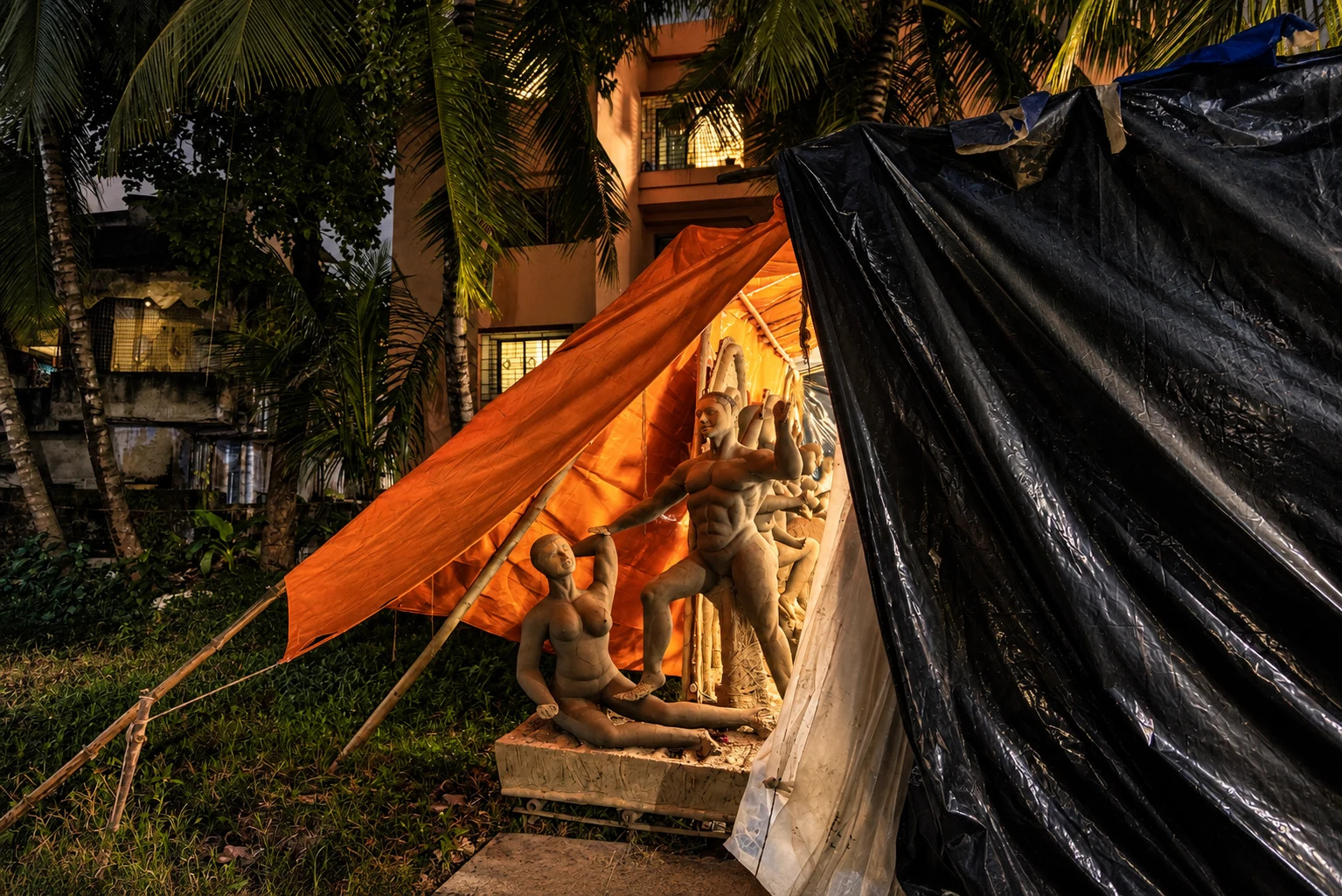 Nighttime Clay Idol Workshop Under Tarps