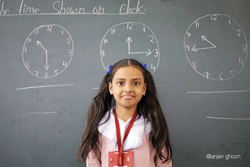 Schoolgirl smiling during a portrait session at Samaritan Mission School